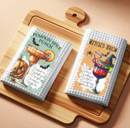 Halloween cocktail recipe waffle weave towel displayed on kitchen counter