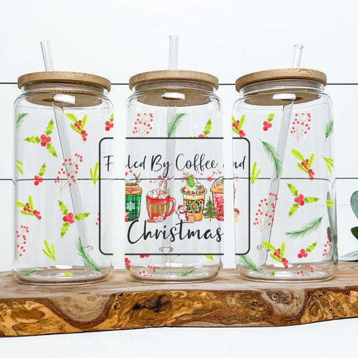 Festive iced coffee tumbler with humorous “Fueled by Coffee and Christmas” phrase, holiday gift for friends or coworkers.