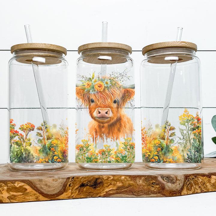 Highland cow tumbler surrounded by flowers, perfect gift for animal lovers