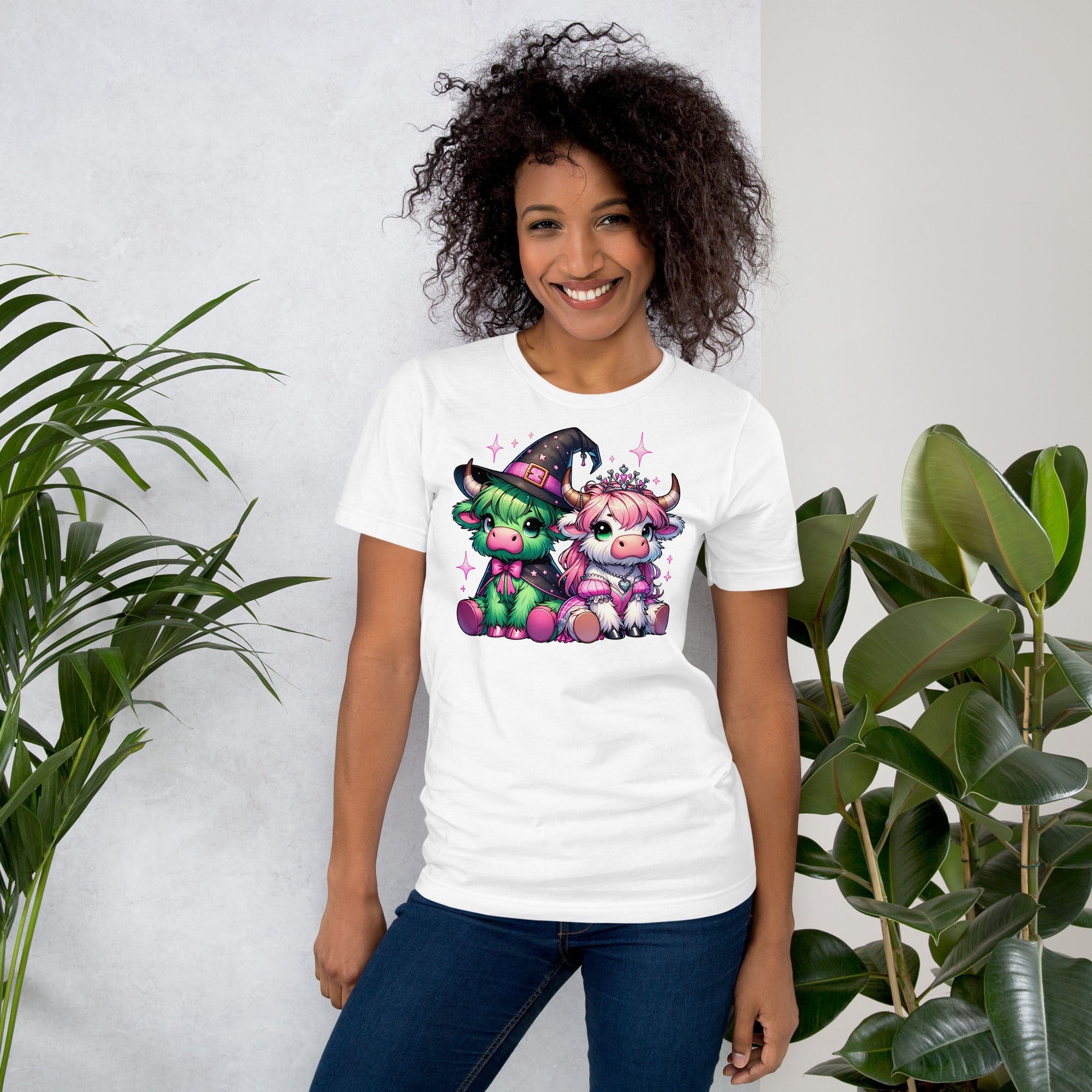 Cute Highland cow shirt with Wicked-inspired green and white cows.