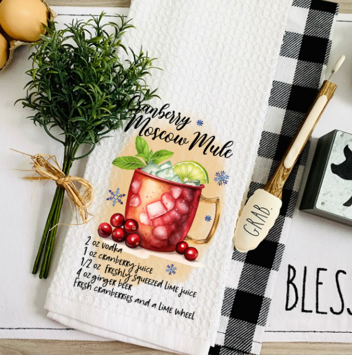 Christmas kitchen decorated with festive cocktail recipe towel and seasonal accents