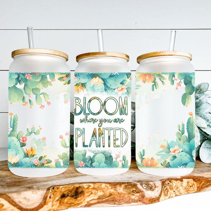 Reusable iced coffee tumbler with floral garden design and motivational “Bloom Where You Are Planted” wording.