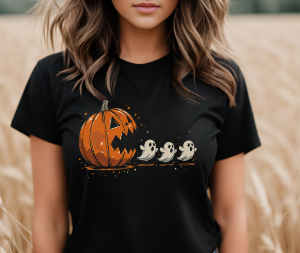 Pumpkin Pac-Man Halloween gaming shirt featuring retro ghost chase design