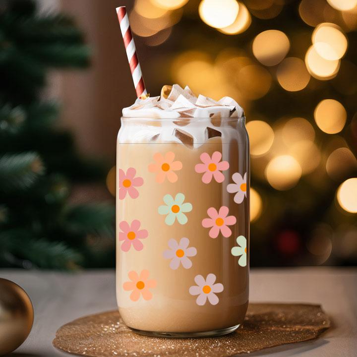 16 oz frosted glass tumbler with pastel daisies, reusable and charming gift for daily iced coffee use.