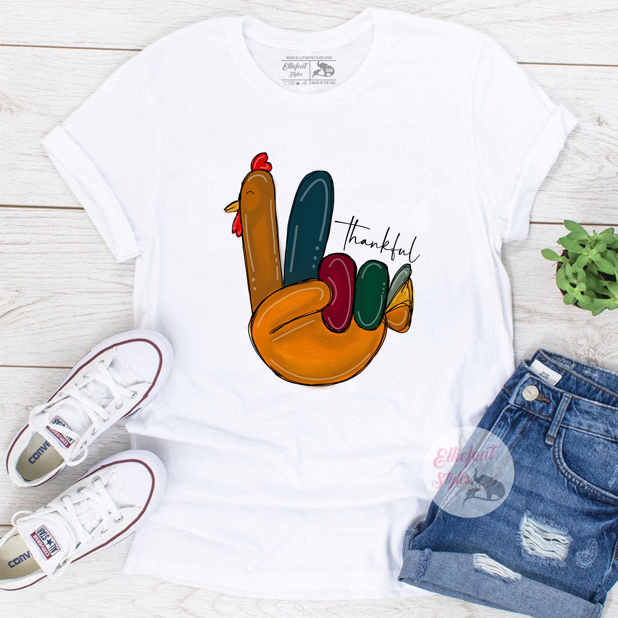 Cozy Thanksgiving tee with turkey handprint artwork for holiday wear