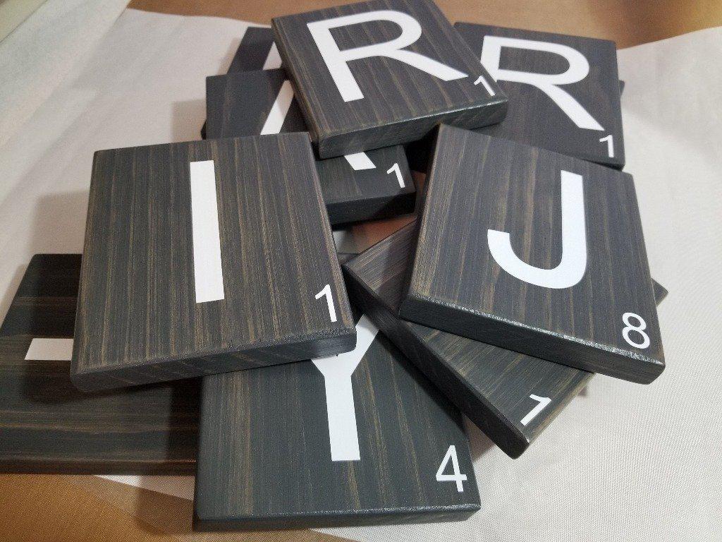 Farmhouse style wooden Scrabble tiles for wall décor.