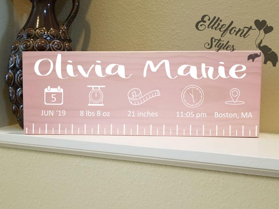 Timeless custom wooden ruler sign capturing newborn’s birth details
