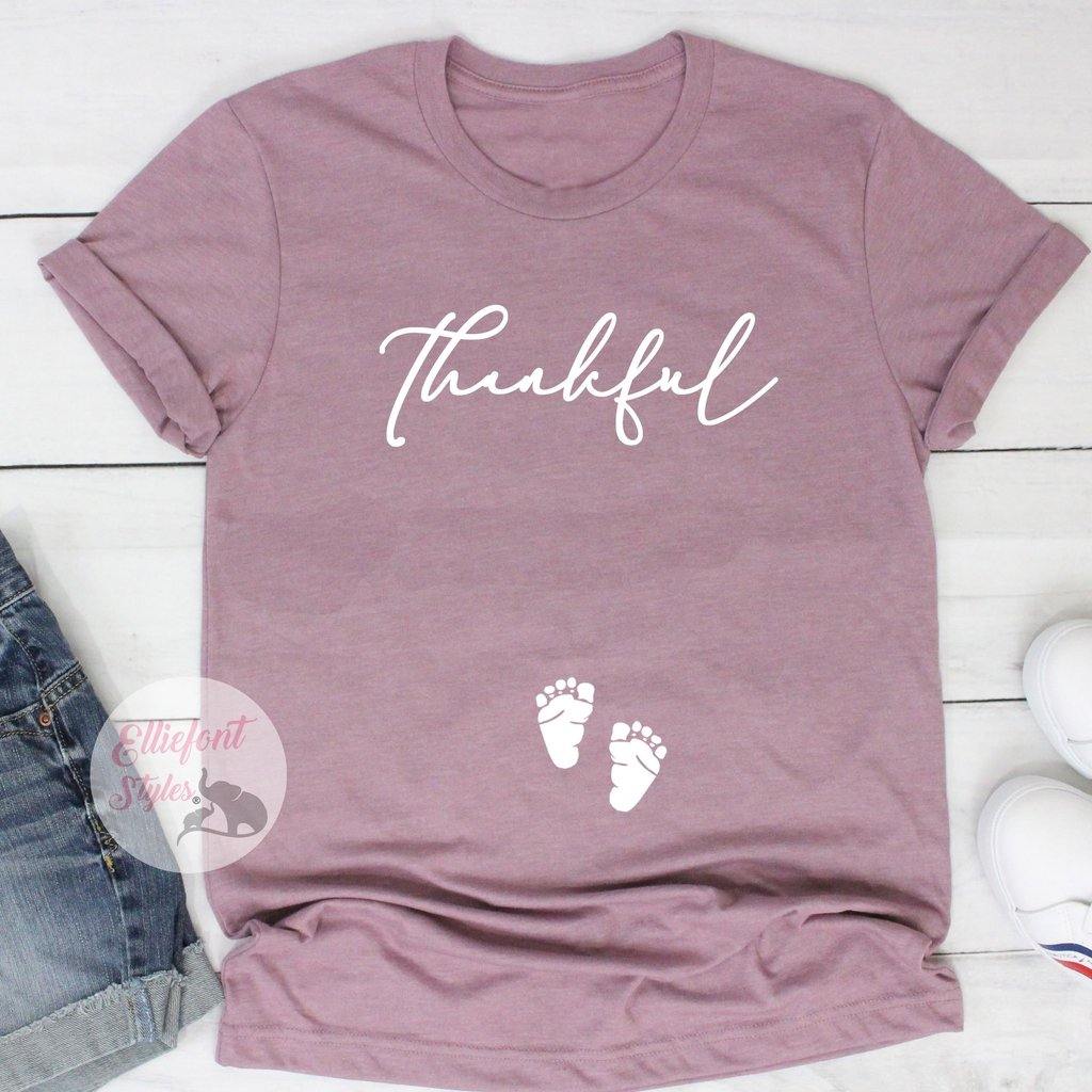 Holiday pregnancy reveal shirt with Thankful design and baby footprints