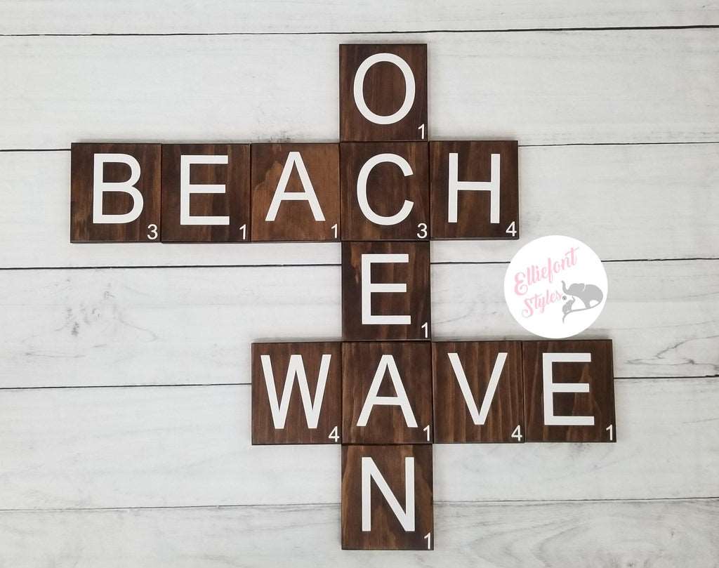 Large wood Scrabble tiles spelling Beach Wave Ocean for wall décor.