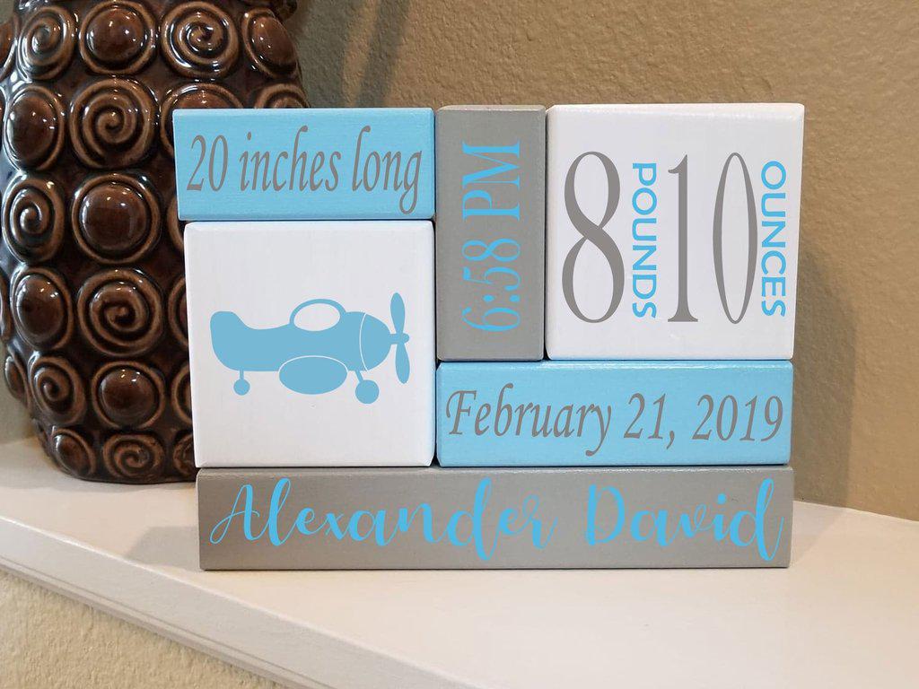 Stacking wooden blocks personalized with baby’s birth details