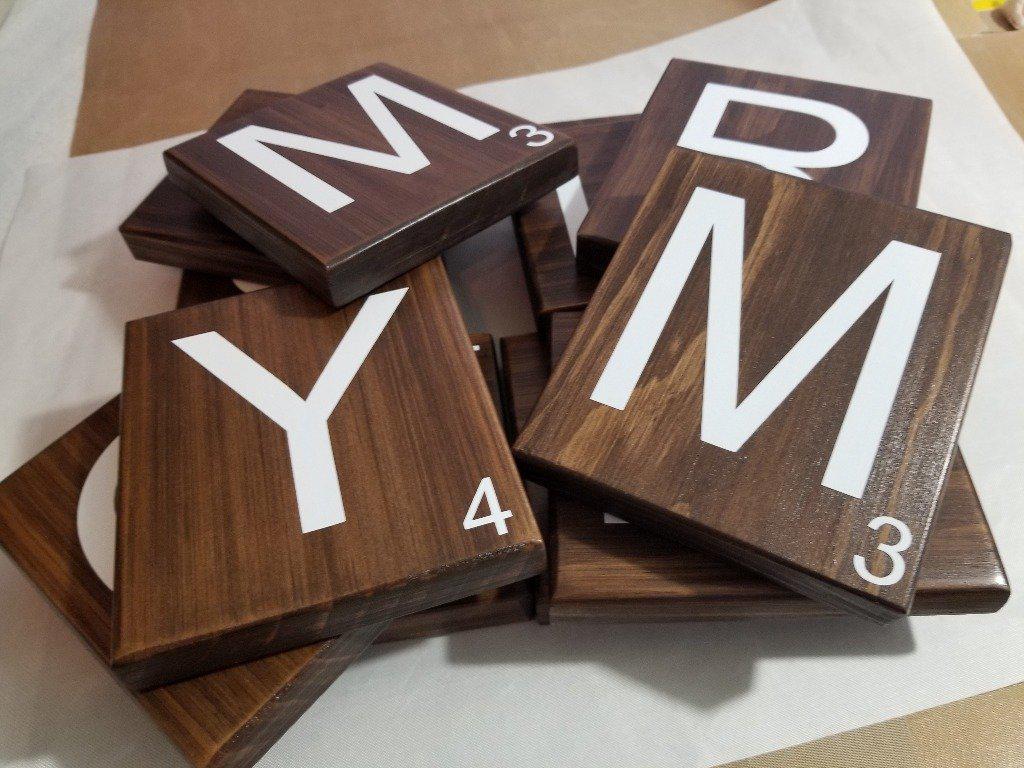 Rustic Scrabble tile wall art arranged in a gallery wall style.