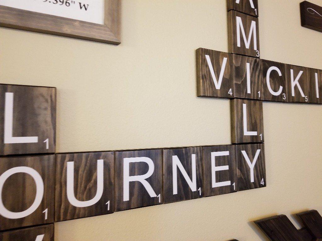 Wooden Scrabble letter tiles for unique wall decoration.