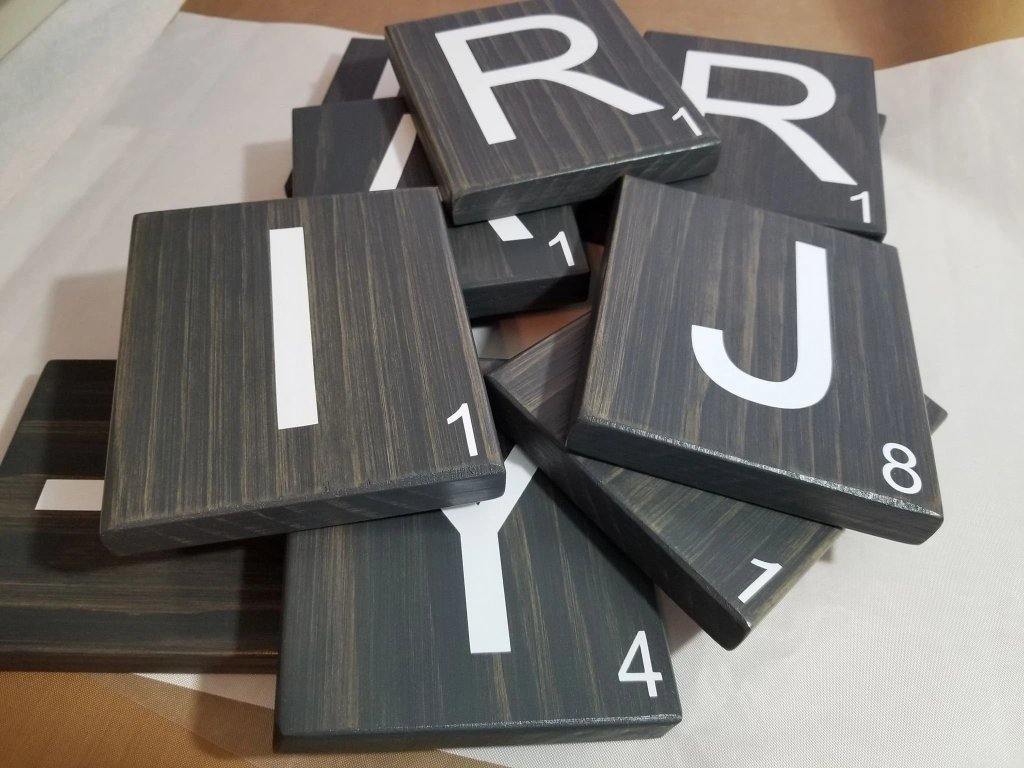 Solid oak Scrabble tile set for gallery wall decoration.