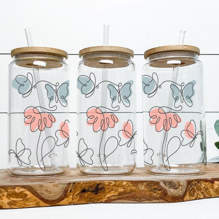 https://www.elliefontstyles.com/cdn/shop/files/86-butterfly-garden-floral-line-art-iced-coffee-cup-glass-tumbler-gifts.jpg?v=1703455396