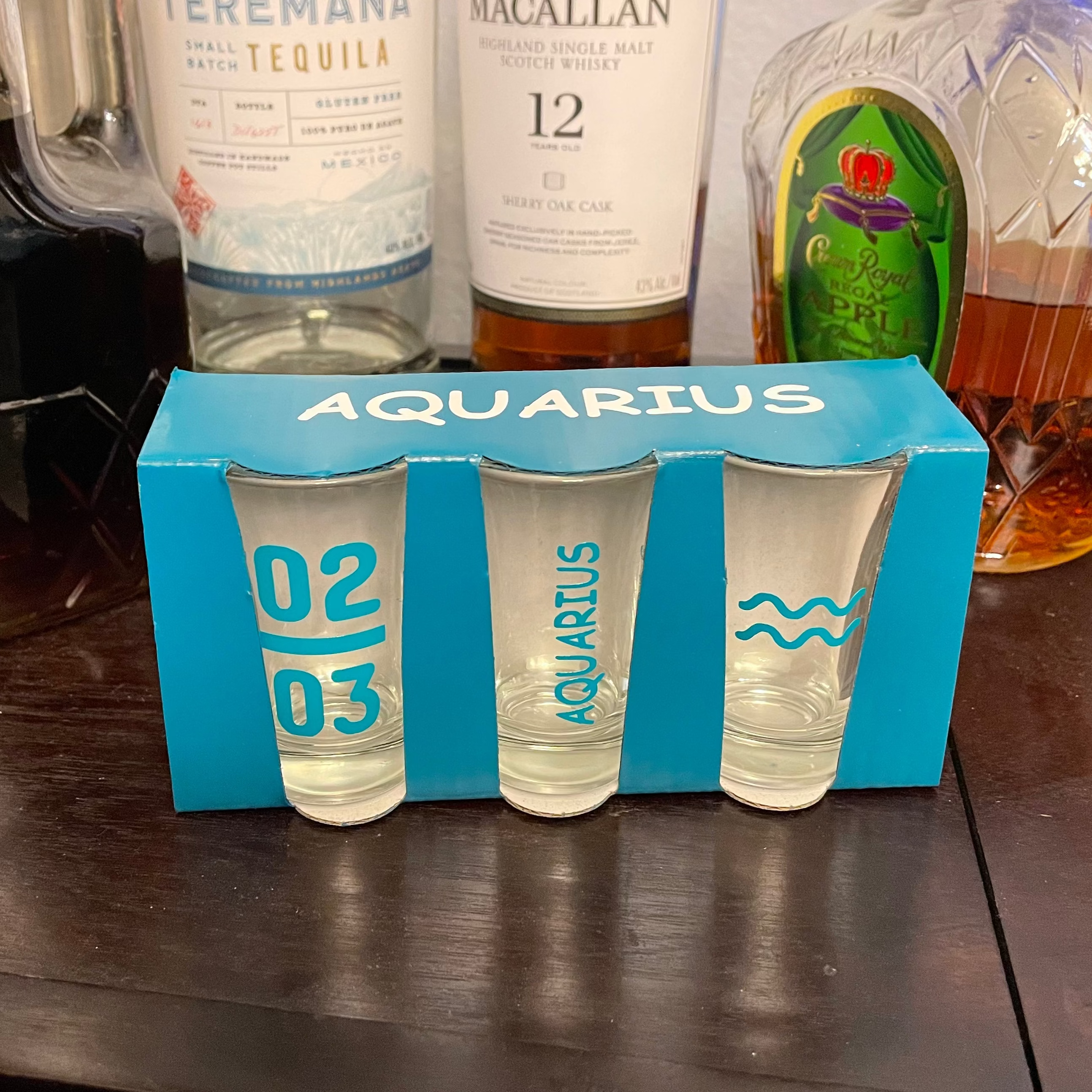 Engraved Aquarius Water Bearer zodiac sign on shot glass