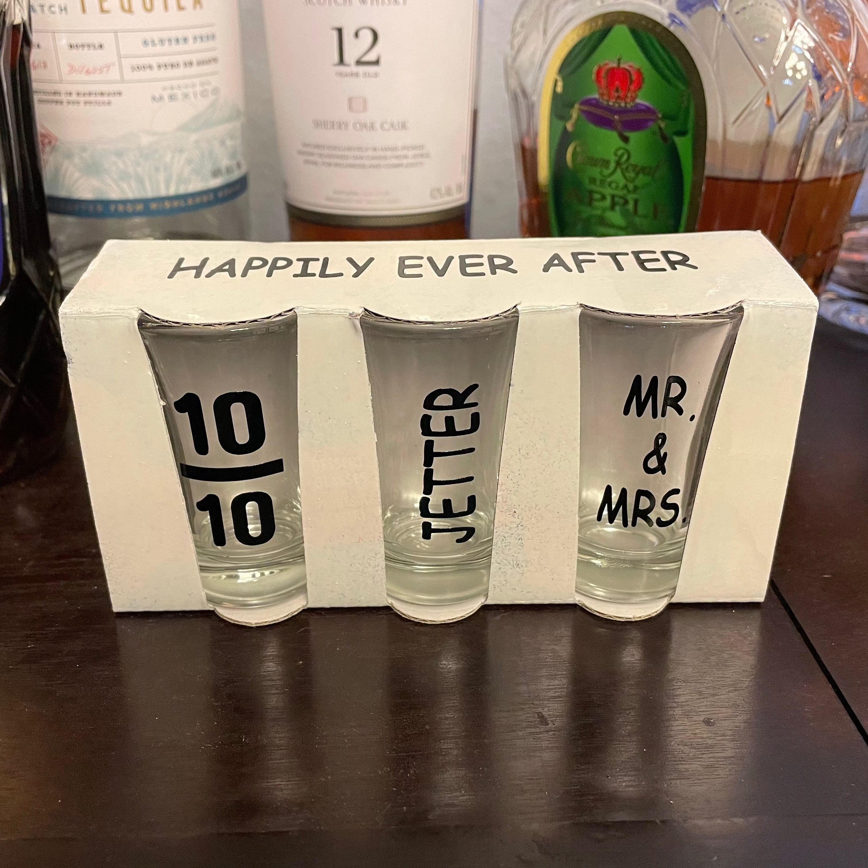 Custom engraved shot glasses featuring couples’ last name for wedding gift