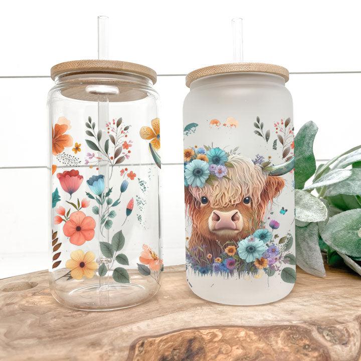 tumbler showing baby Highland cow surrounded by colorful flowers, perfect gift idea.