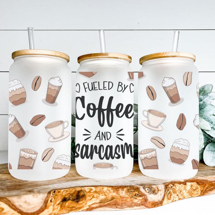 Libby Glass Can Tumbler with “Fueled by Coffee and Sarcasm” phrase and coffee bean design, funny gift for coffee lovers.