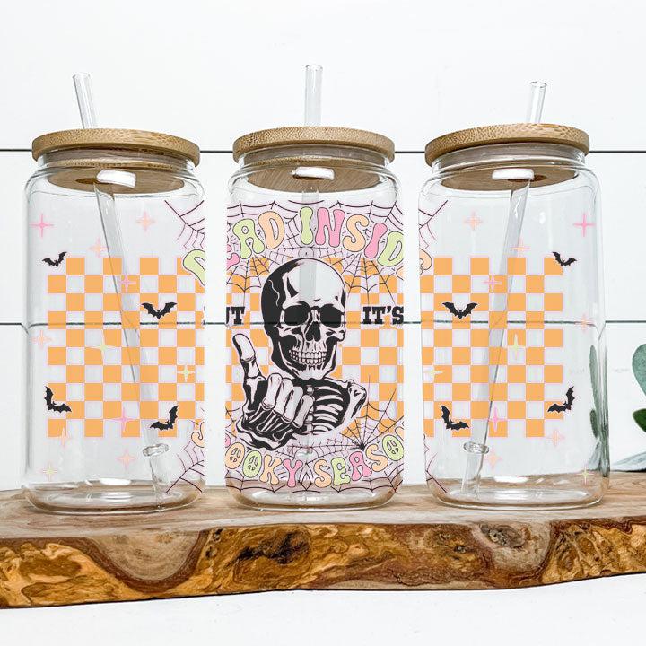Reusable iced coffee tumbler featuring skeleton and “Dead Inside But It’s Spooky Season” phrase, fun gift for friends or coworkers.