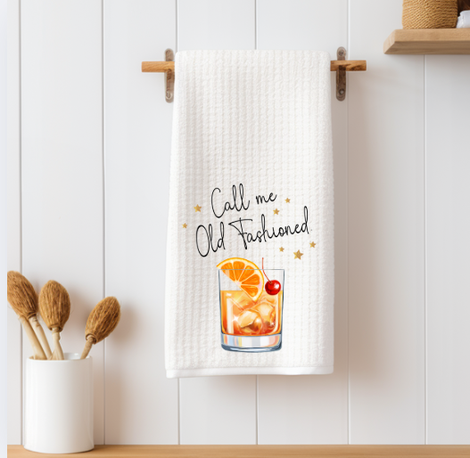 Old Fashioned cocktail recipe towel styled as whiskey lover gift in kitchen
