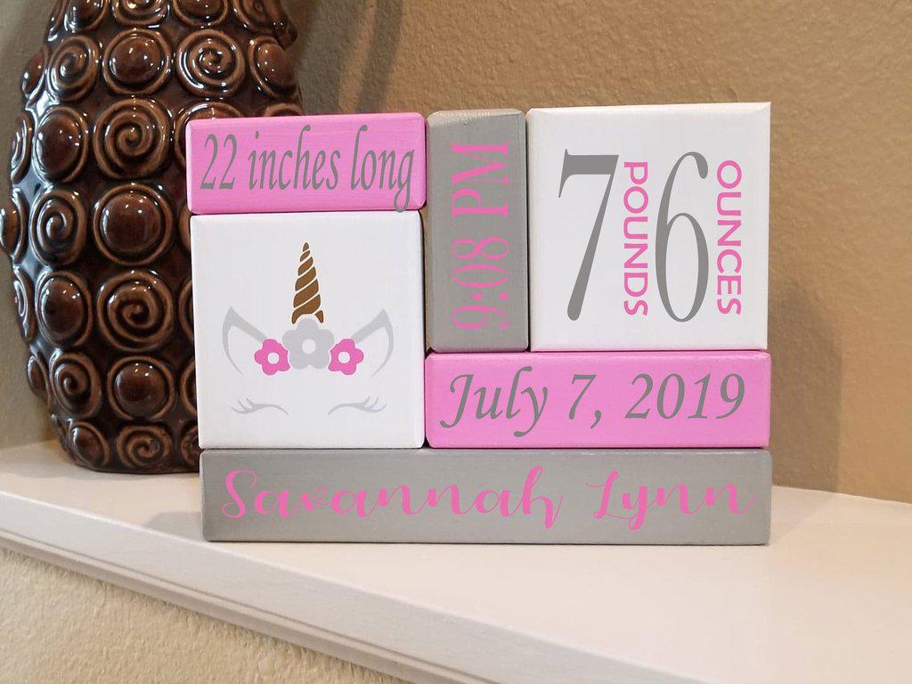 Custom wooden stacking blocks designed as a newborn baby gift