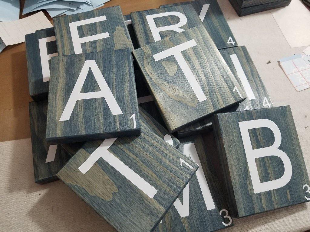 Farmhouse style wall décor with large Scrabble tiles.