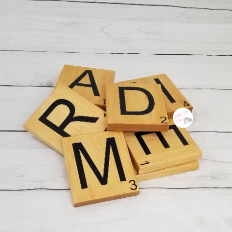 Large wood Scrabble tiles used as rustic wall art décor.